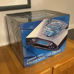 Sharper Image Metro One-cd Stereo Player Speakers Remote New In Sealed Box Rare. Fixed Price $299.99.