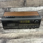 Lxi 667 24288 290 Am/fm Alarm Clock Radio Cassette Stereo Black Woodgrain. Fixed Price $34.99.